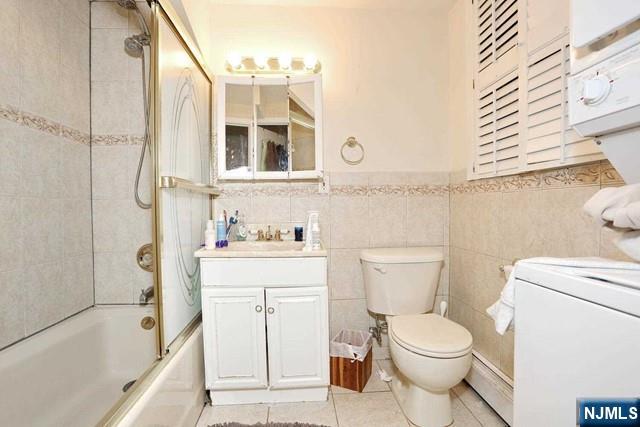84 12th Street Cresskill, NJ 07626 - Photo 29 of 45 a bathroom with a sink toilet and shower