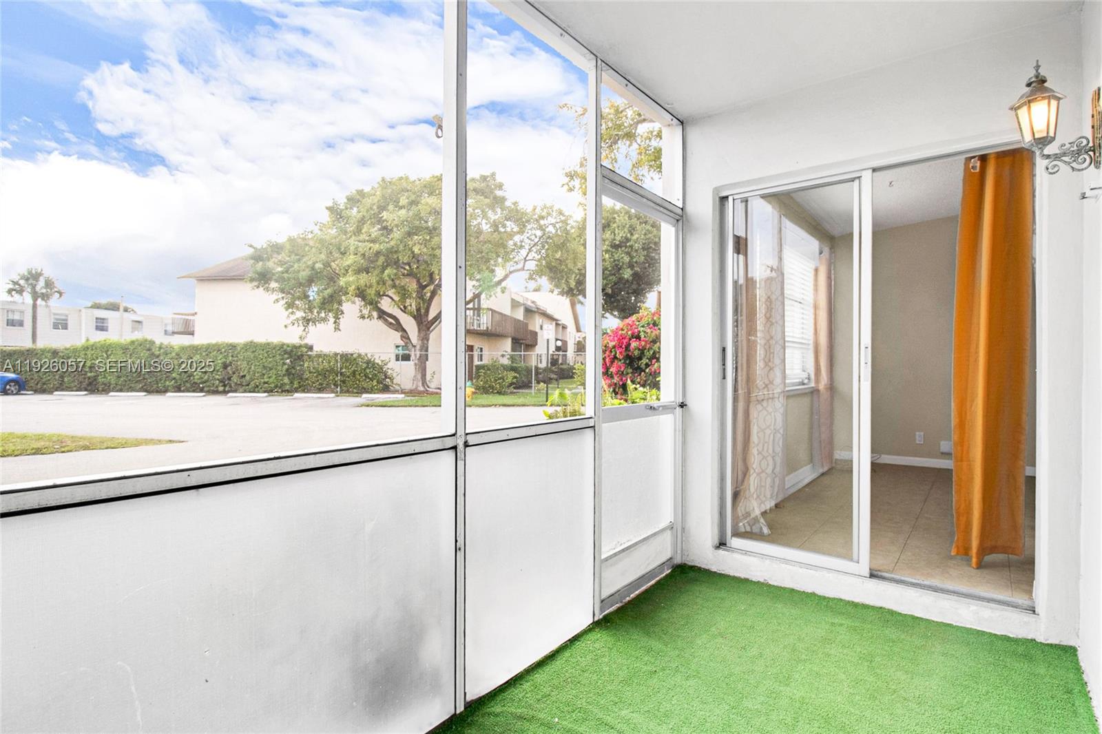 6505 Winfield Boulevard, Unit B4 Margate, FL 33063 - Photo 19 of 25 a view of an entryway with a floor to ceiling window