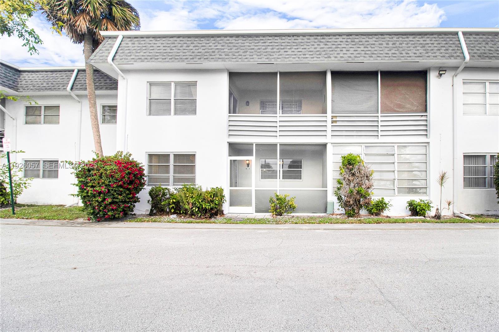 6505 Winfield Boulevard, Unit B4 Margate, FL 33063 - Photo 20 of 25 a front view of a house with a yard