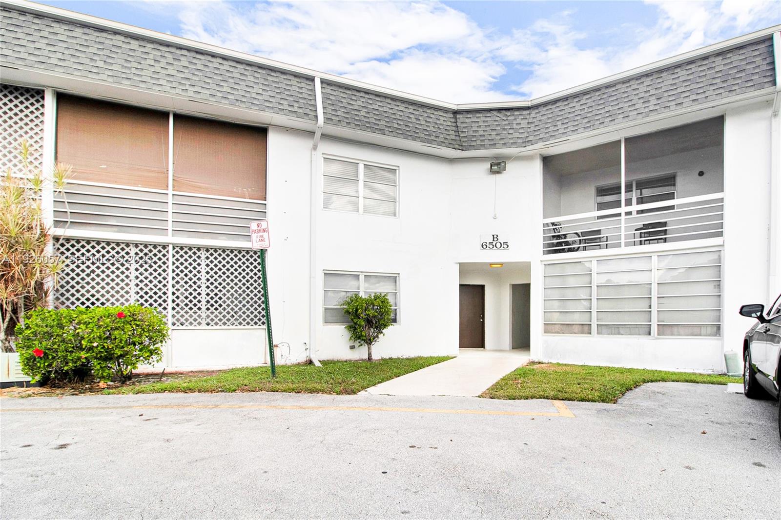 6505 Winfield Boulevard, Unit B4 Margate, FL 33063 - Photo 22 of 25 a front view of a house with a garage
