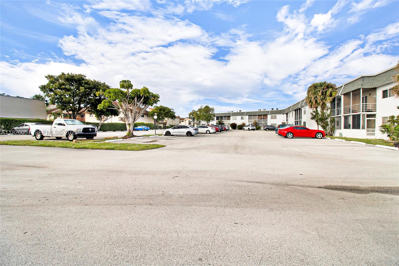 6505 Winfield Boulevard, Unit B4 Margate, FL 33063 - Photo 25 of 25 a street with cars parked in front of it