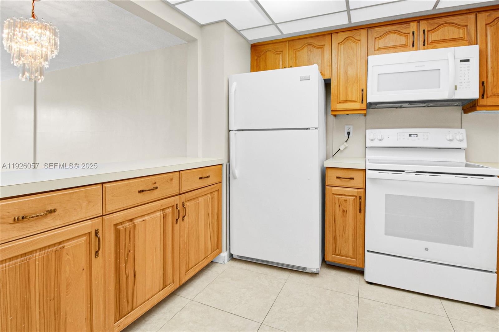 6505 Winfield Boulevard, Unit B4 Margate, FL 33063 - Photo 7 of 25 a kitchen with stainless steel appliances a refrigerator and a stove