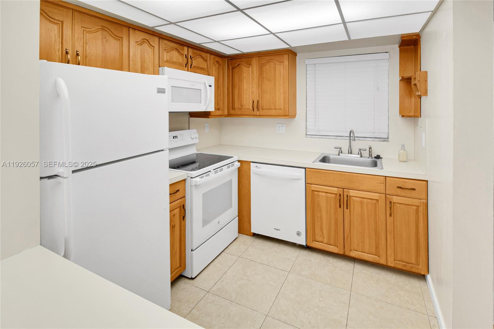 6505 Winfield Boulevard, Unit B4 Margate, FL 33063 - Photo 8 of 25 a utility room with cabinets washer and dryer