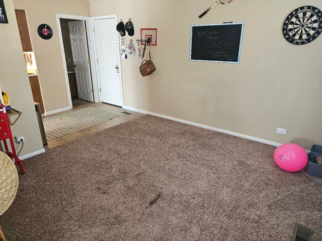 a view of a livingroom with table and chair