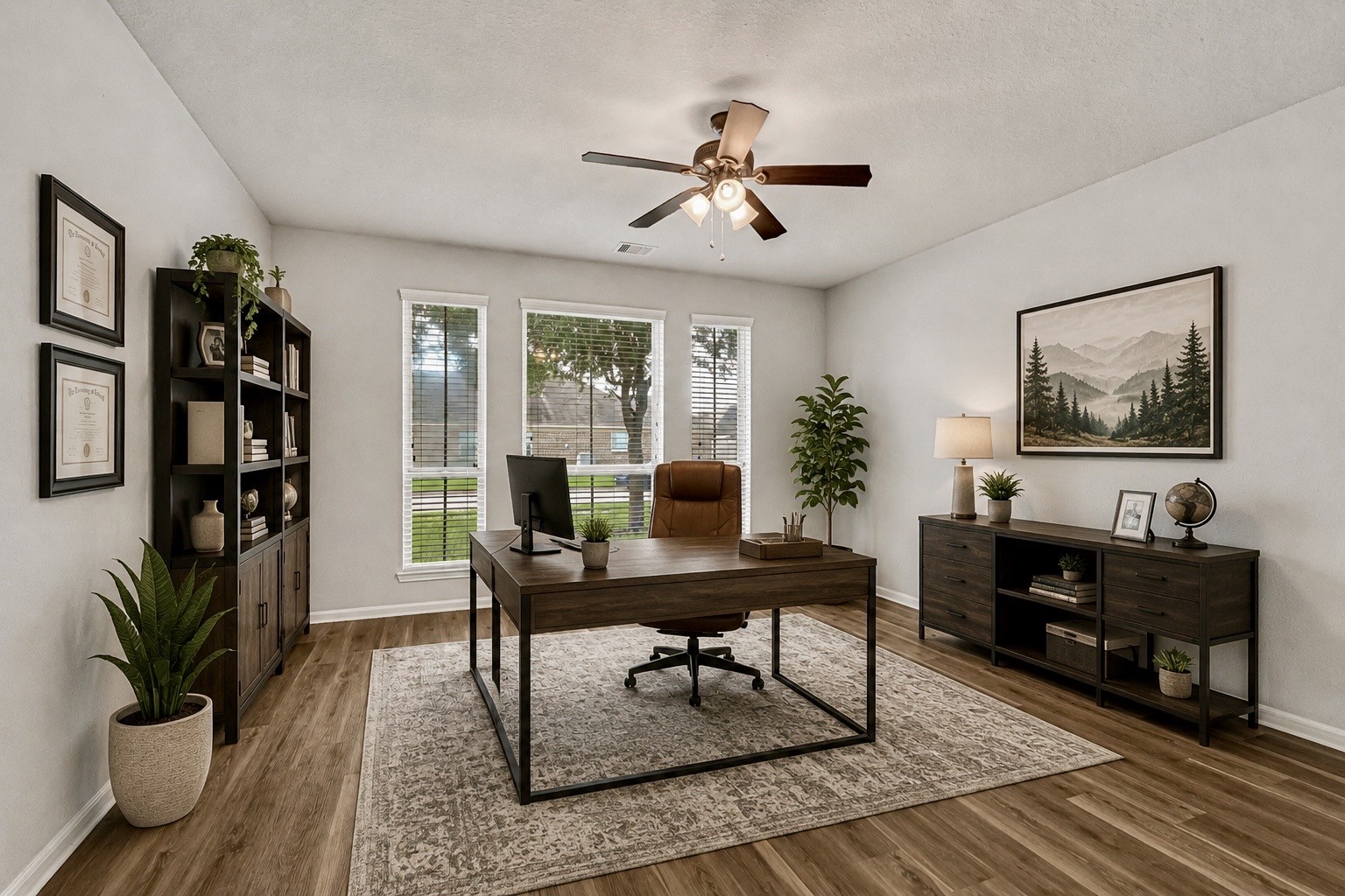 5331 Seabird Street Baytown, TX 77521 - Photo 5 of 38 a living room with furniture a bookshelf and a potted plant