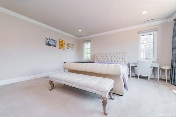 a bed room with a bed and a chair