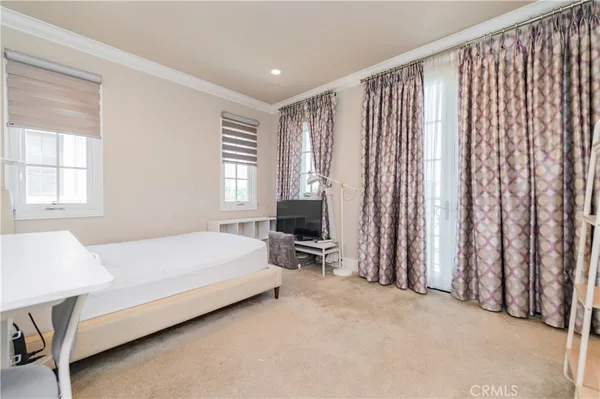 a bedroom with a bed and a table