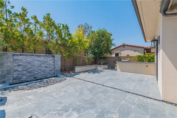 a view of a house with a yard and a garage