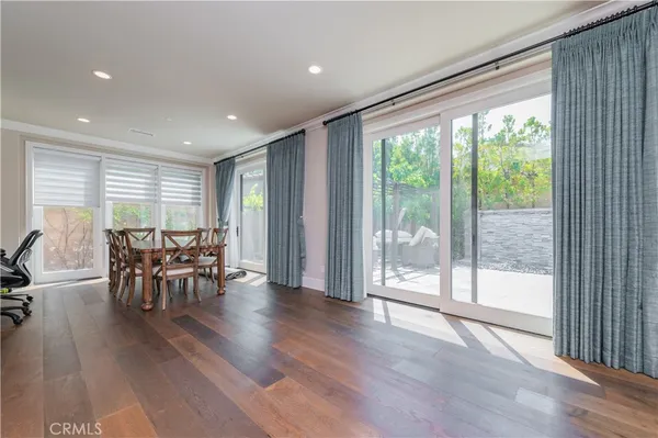 a view of a work space with furniture and wooden floor
