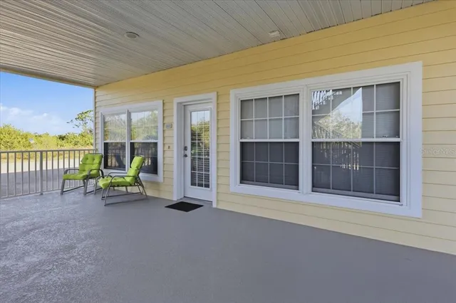 a view of an empty room with a balcony