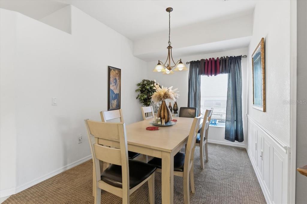 102 Natures Way, Unit 2101 Rotonda West, FL 33947 - Photo 11 of 49 a dining room with furniture and window