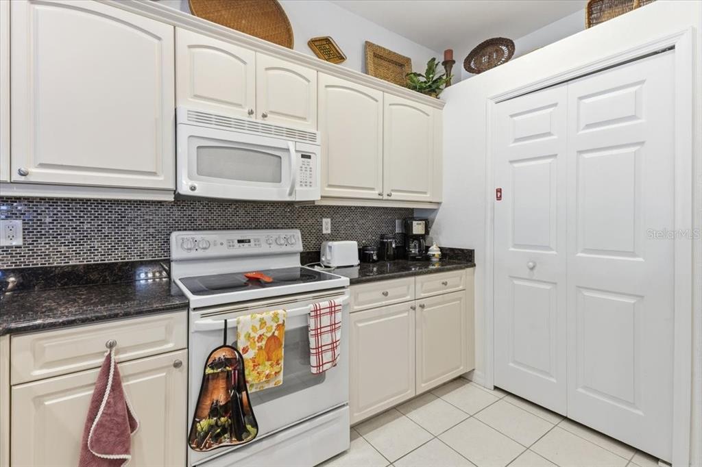 102 Natures Way, Unit 2101 Rotonda West, FL 33947 - Photo 13 of 49 a kitchen with stainless steel appliances granite countertop a sink and cabinets