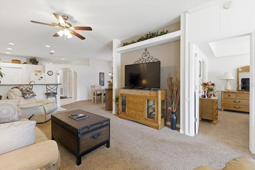 102 Natures Way, Unit 2101 Rotonda West, FL 33947 - Photo 19 of 49 a living room with furniture and a flat screen tv