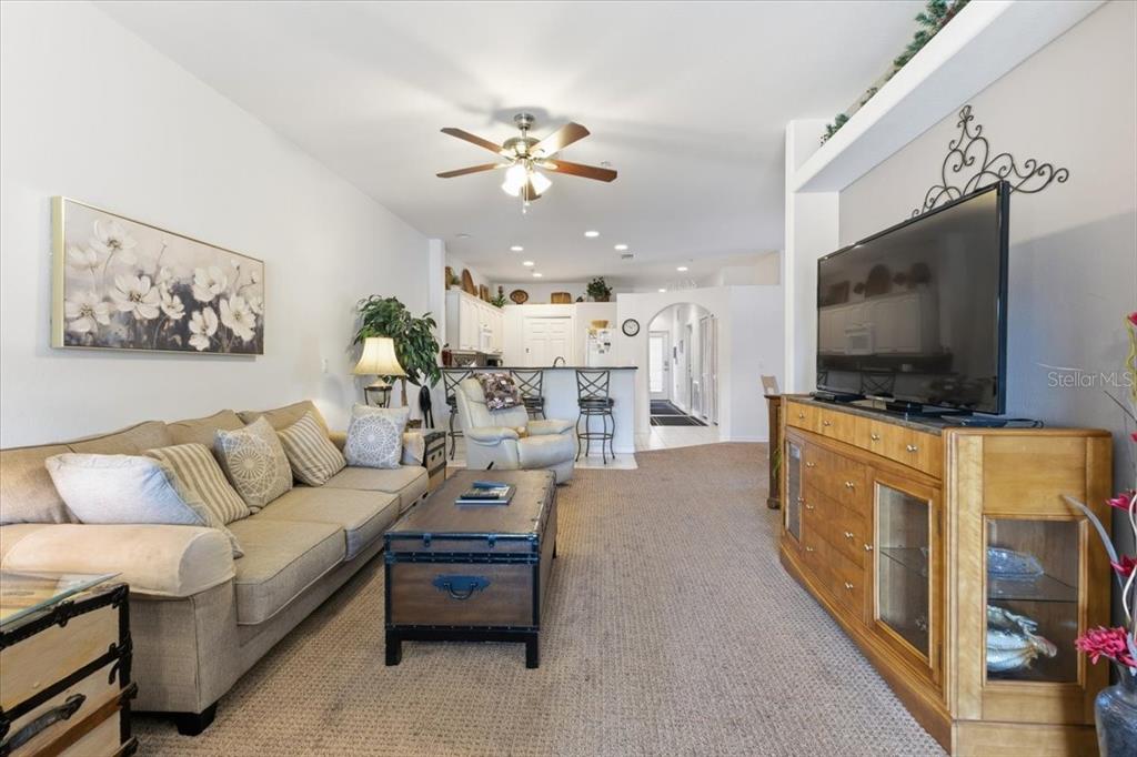 102 Natures Way, Unit 2101 Rotonda West, FL 33947 - Photo 20 of 49 a living room with furniture and a flat screen tv