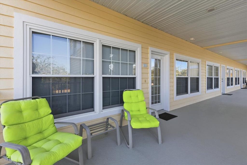 102 Natures Way, Unit 2101 Rotonda West, FL 33947 - Photo 2 of 49 a building outdoor space with seating space