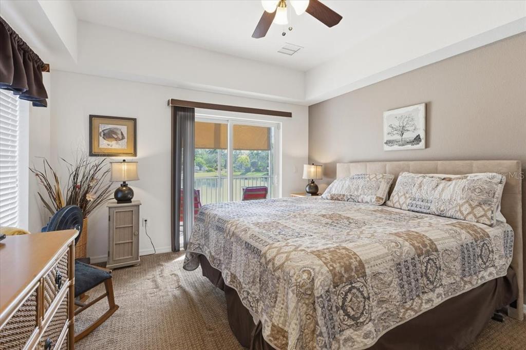 102 Natures Way, Unit 2101 Rotonda West, FL 33947 - Photo 26 of 49 a bedroom with a large bed and a window