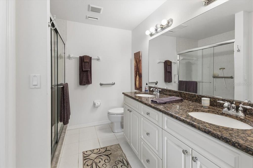 102 Natures Way, Unit 2101 Rotonda West, FL 33947 - Photo 27 of 49 a bathroom with a granite countertop sink and a mirror