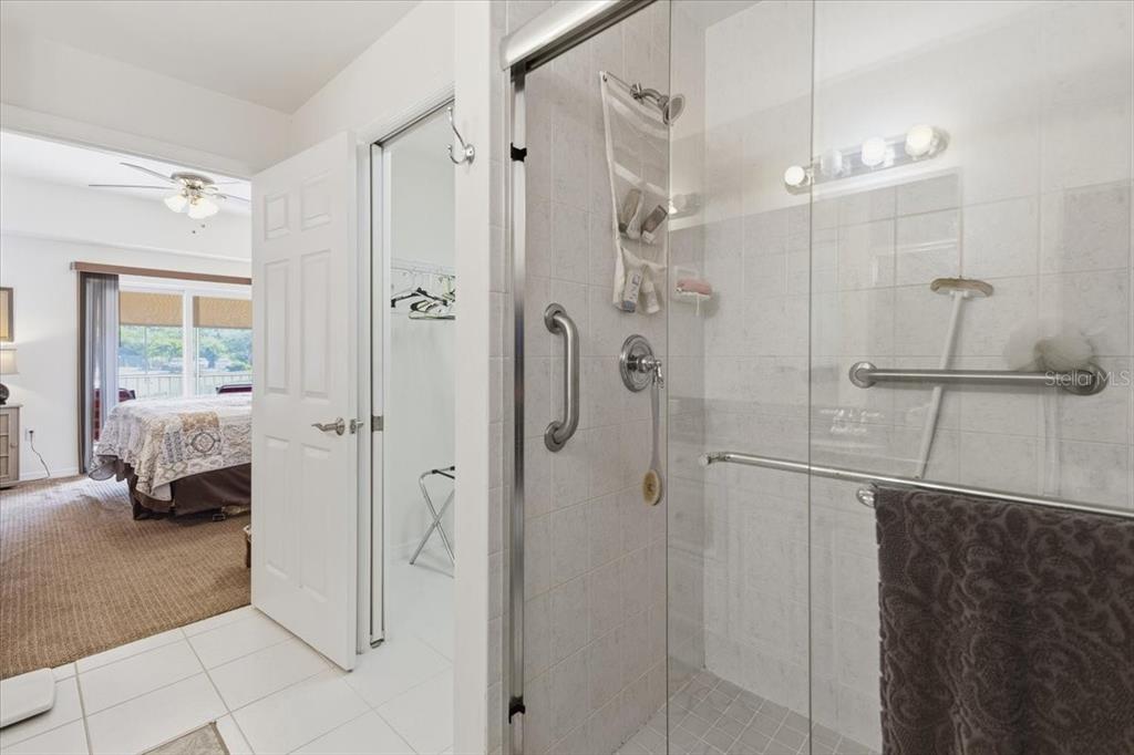 102 Natures Way, Unit 2101 Rotonda West, FL 33947 - Photo 29 of 49 a bathroom with a shower and a sink