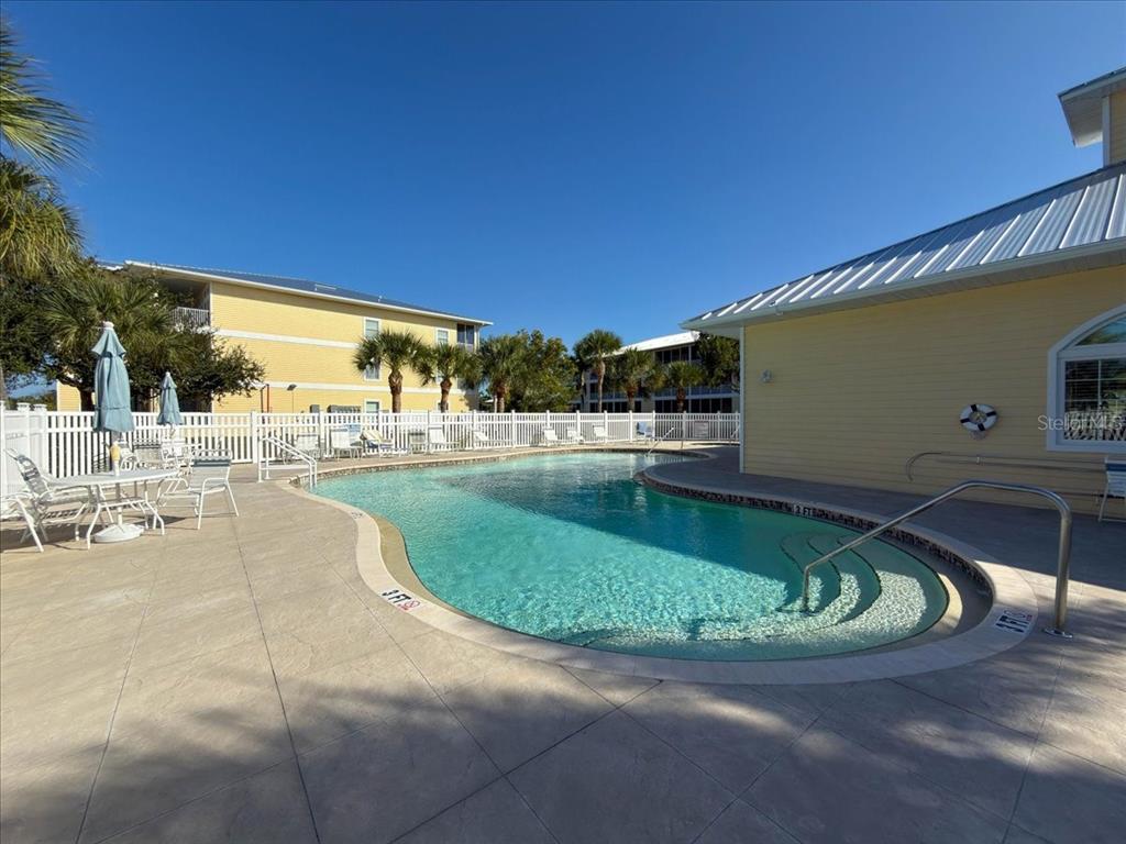 102 Natures Way, Unit 2101 Rotonda West, FL 33947 - Photo 36 of 49 a view of a swimming pool with a patio