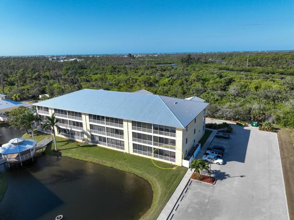 102 Natures Way, Unit 2101 Rotonda West, FL 33947 - Photo 40 of 49 an aerial view of a house with a garden space
