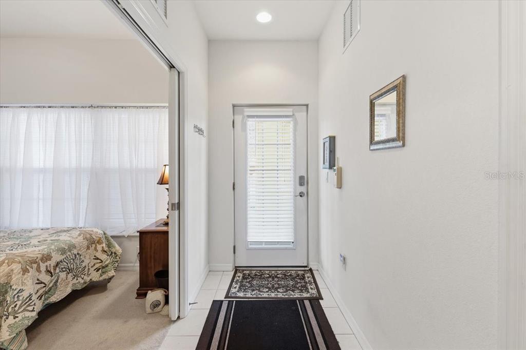 102 Natures Way, Unit 2101 Rotonda West, FL 33947 - Photo 4 of 49 a bedroom with a bed and a rug