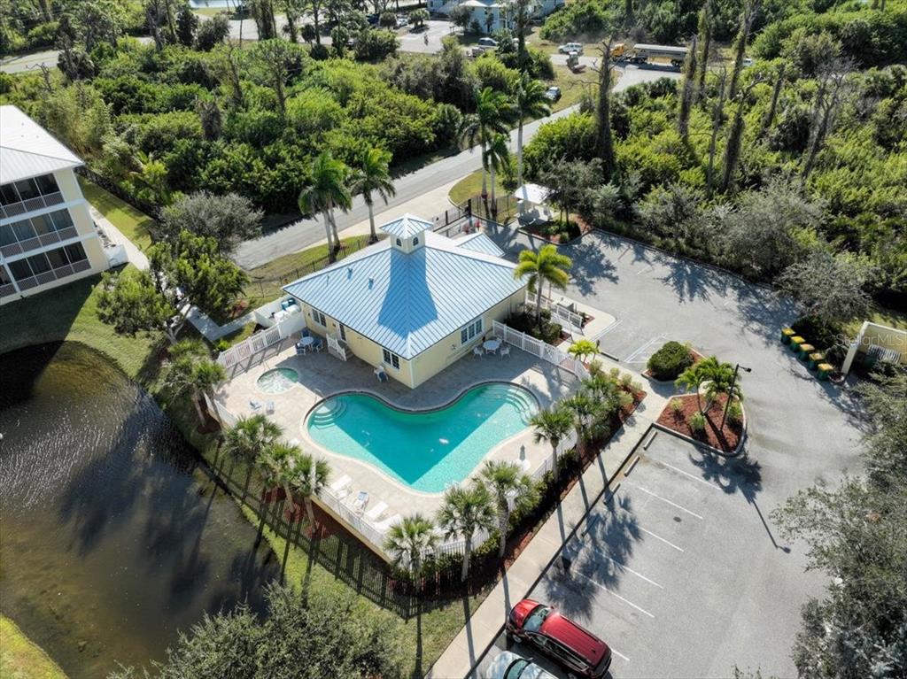 102 Natures Way, Unit 2101 Rotonda West, FL 33947 - Photo 45 of 49 an aerial view of a house with a yard