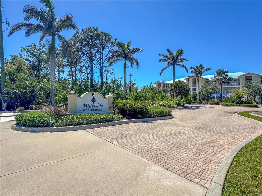 102 Natures Way, Unit 2101 Rotonda West, FL 33947 - Photo 46 of 49 a view of a garden with palm trees