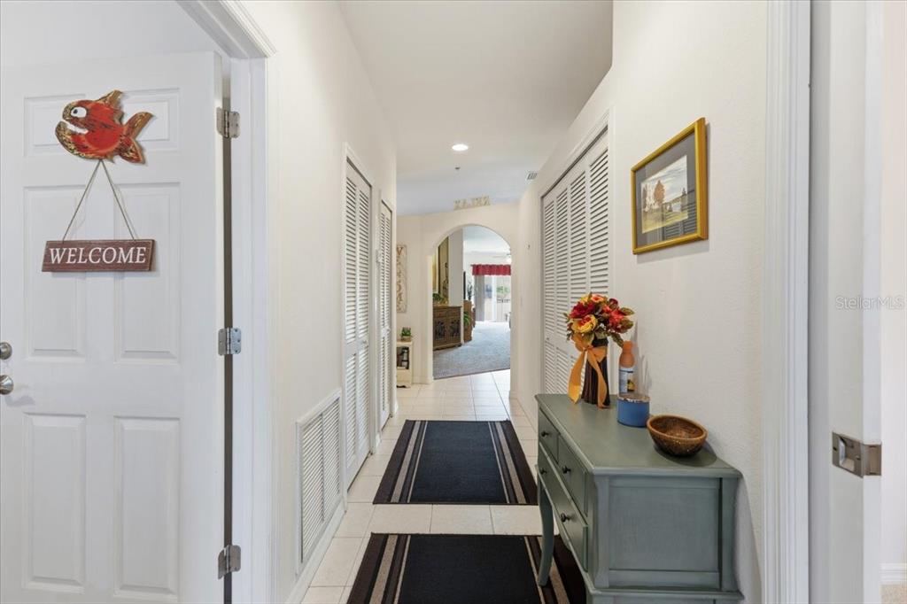 102 Natures Way, Unit 2101 Rotonda West, FL 33947 - Photo 6 of 49 a hallway with a view of living room
