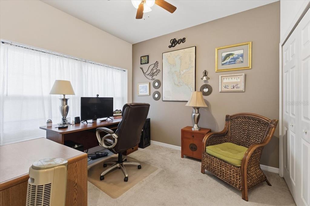 102 Natures Way, Unit 2101 Rotonda West, FL 33947 - Photo 7 of 49 a view of a workspace with furniture and a window