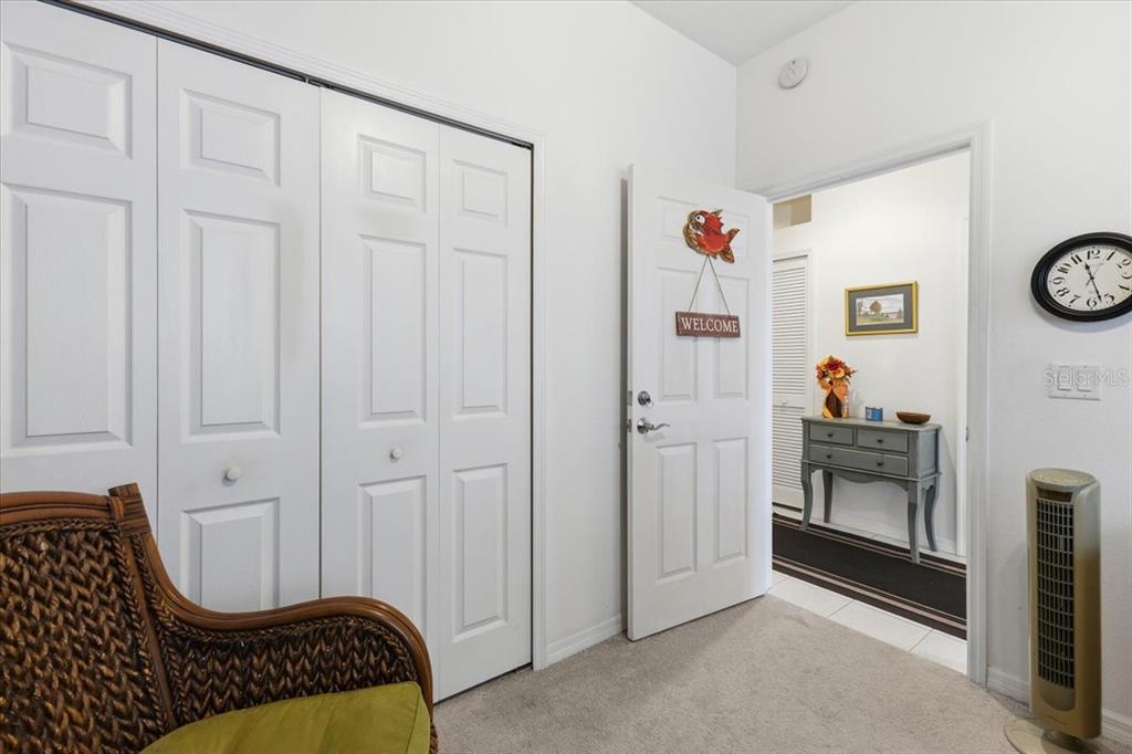 102 Natures Way, Unit 2101 Rotonda West, FL 33947 - Photo 8 of 49 a room with painting and a table