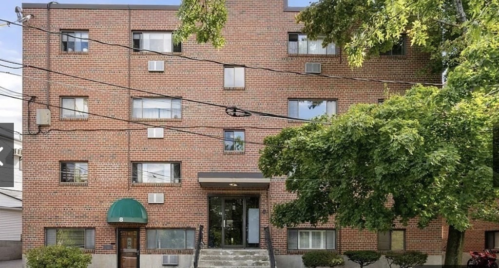 8 Riverside Street, Unit 13 Watertown, MA 02472 - Photo 1 of 18 a front view of a building