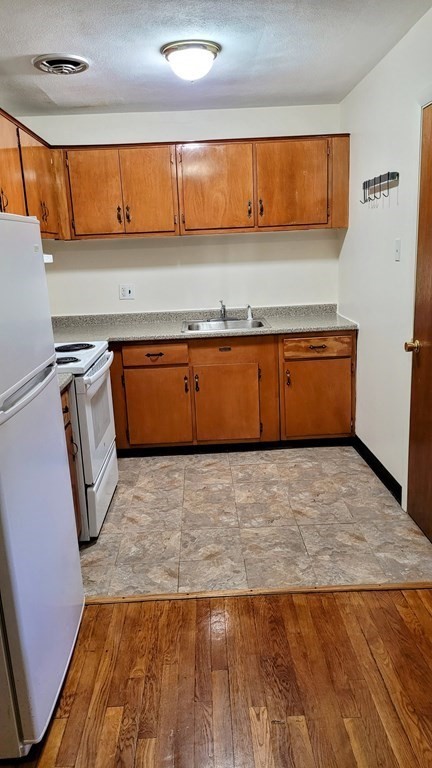 8 Riverside Street, Unit 13 Watertown, MA 02472 - Photo 10 of 18 a view of room with wooden floor