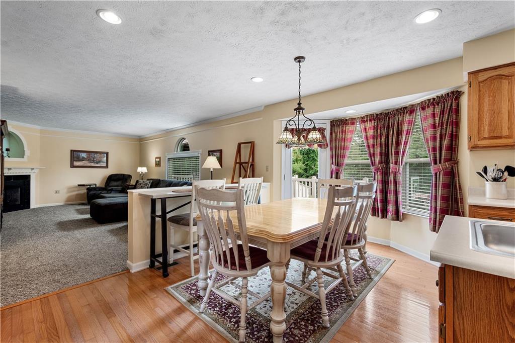 136 Maclaine Drive Carnegie, PA 15106 - Photo 15 of 30 a view of a dining room with furniture window and wooden floor