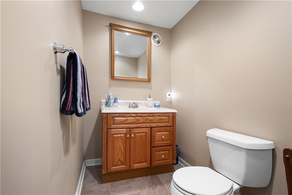 136 Maclaine Drive Carnegie, PA 15106 - Photo 29 of 30 a bathroom with a toilet sink vanity and mirror