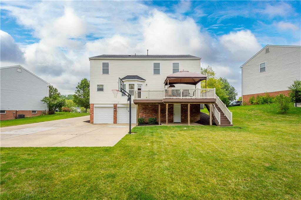 136 Maclaine Drive Carnegie, PA 15106 - Photo 3 of 30 a view of a house with a big yard and large trees