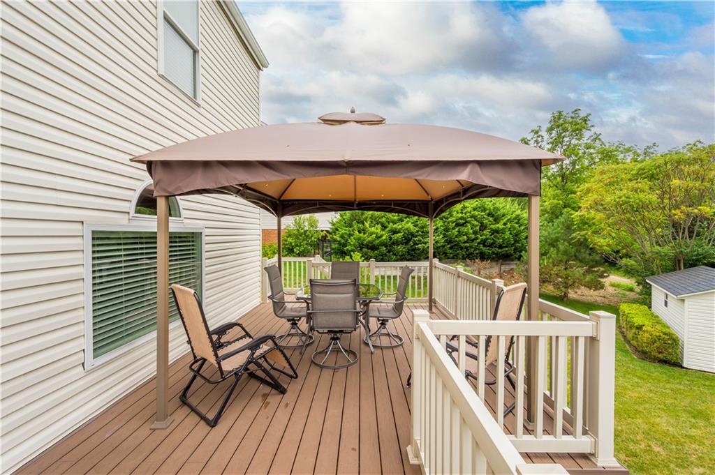 136 Maclaine Drive Carnegie, PA 15106 - Photo 5 of 30 a view of a patio with table and chairs with wooden floor and fence