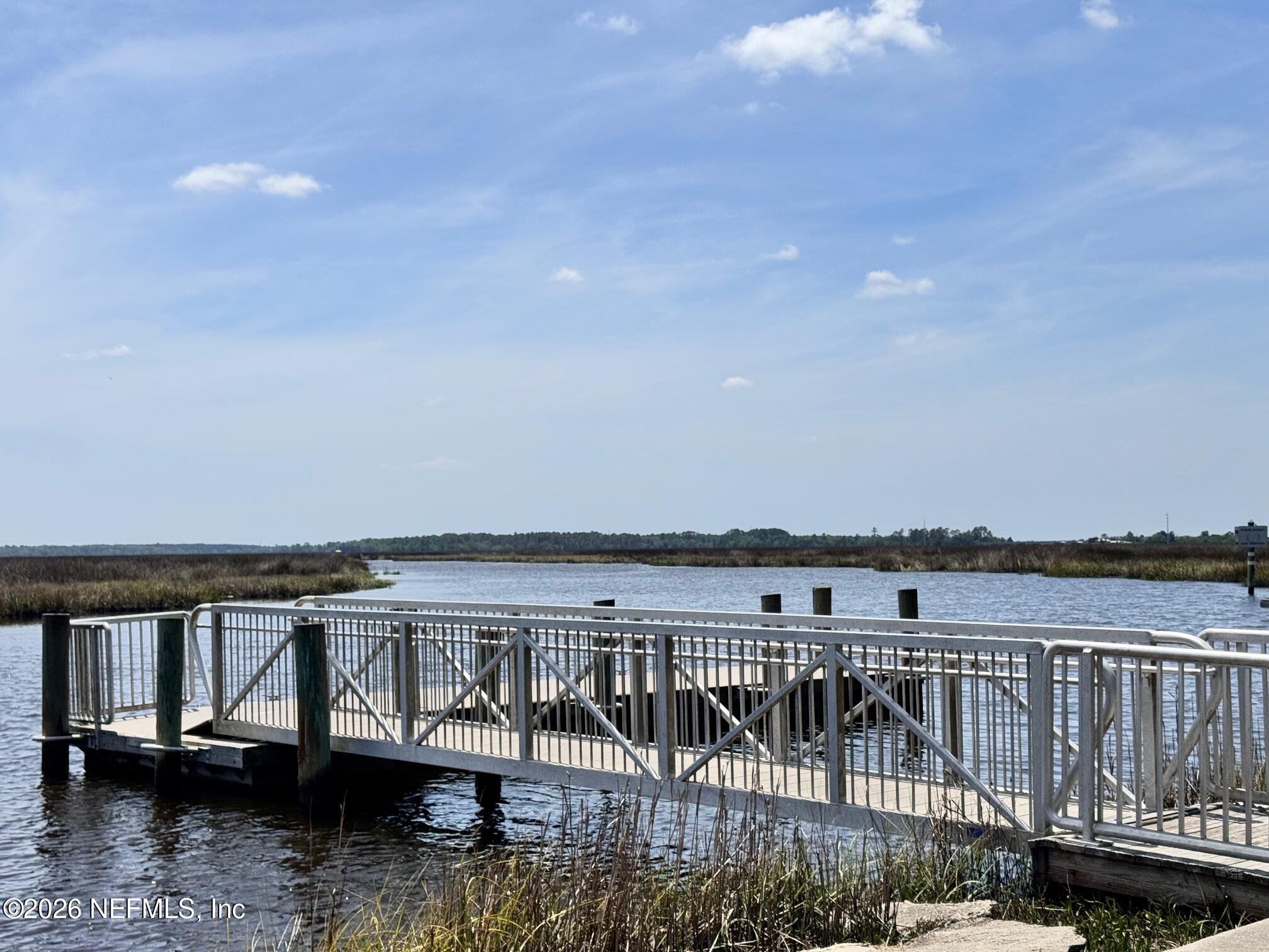 1293 Claxton Road Yulee, FL 32097 - Photo 16 of 19 a view of a roof deck with wooden floor and fence
