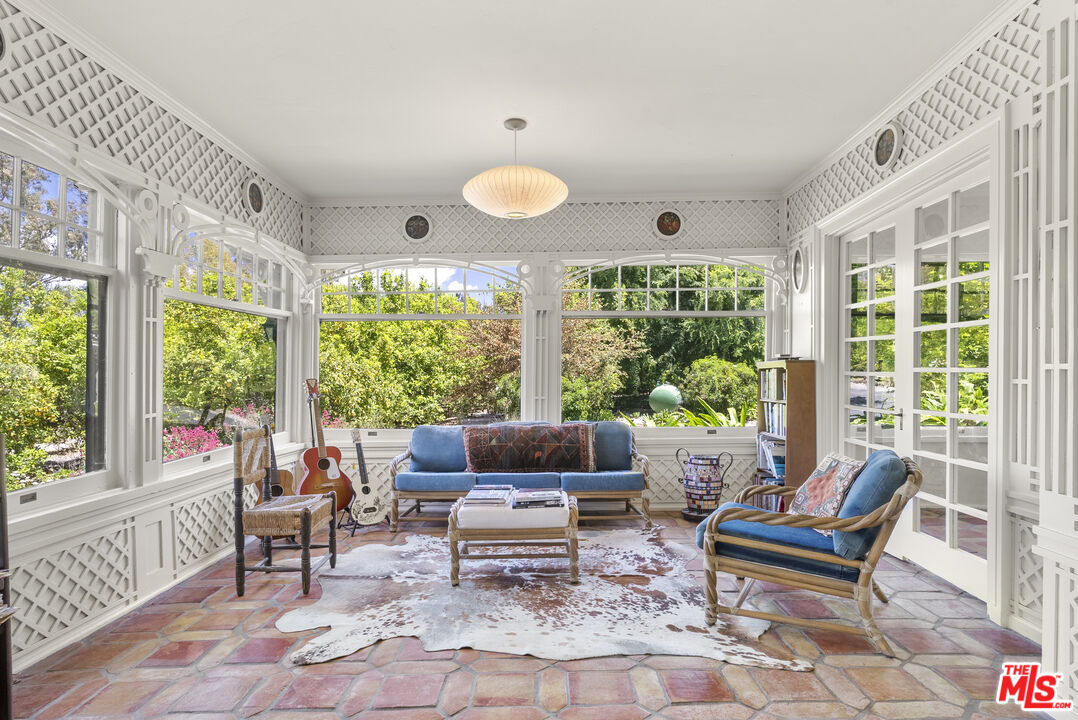 15454 South Mountain Road Oxnard, CA 93036 - Photo 15 of 65 a living room with furniture and large windows