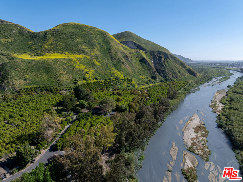15454 South Mountain Road Oxnard, CA 93036 - Photo 2 of 65 a view of a lake with a mountain in the background