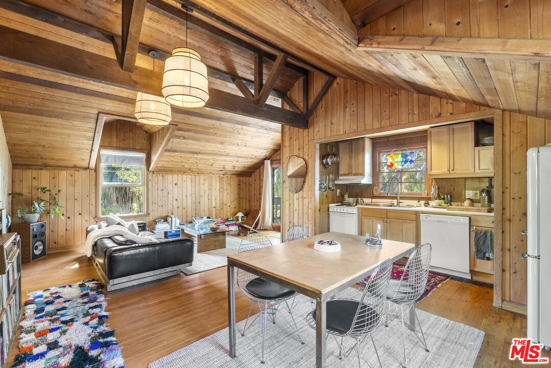 15454 South Mountain Road Oxnard, CA 93036 - Photo 50 of 65 a living room with stainless steel appliances kitchen island granite countertop furniture and a rug