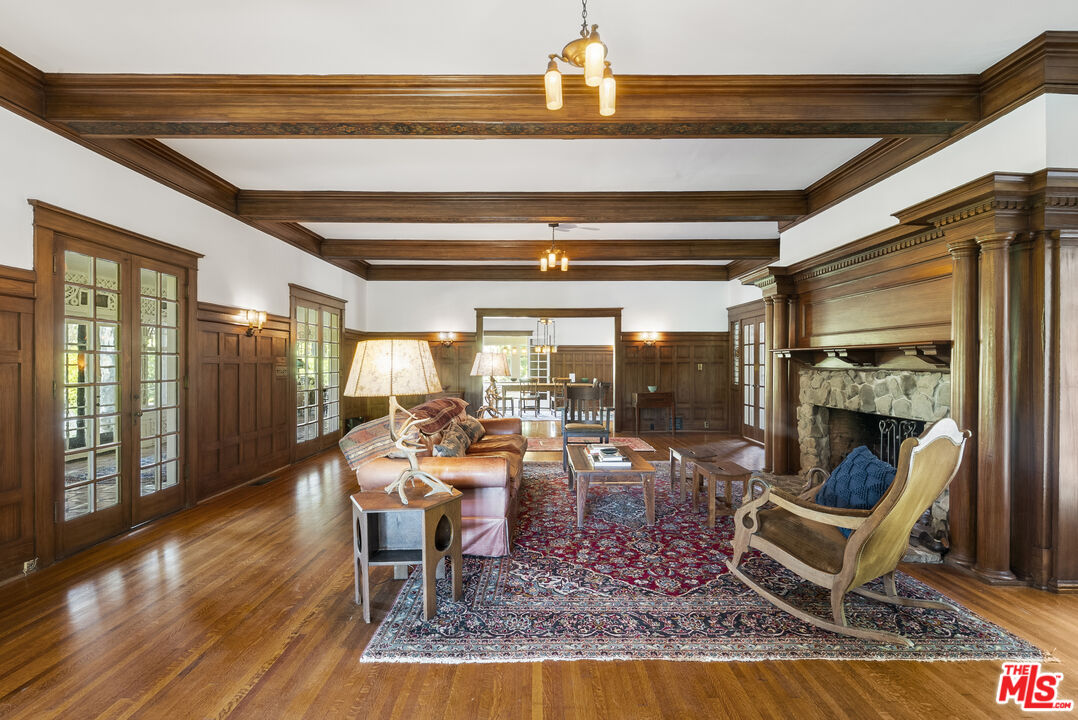 15454 South Mountain Road Oxnard, CA 93036 - Photo 7 of 65 a living room with fireplace furniture and a floor to ceiling window