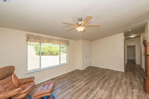 a view of livingroom with furniture window and wooden floor