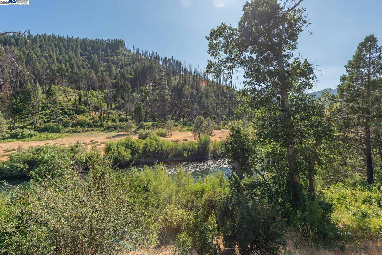 38500 Highway 299 Junction City, CA 96048 - Photo 2 of 49 a view of a lake with a mountain
