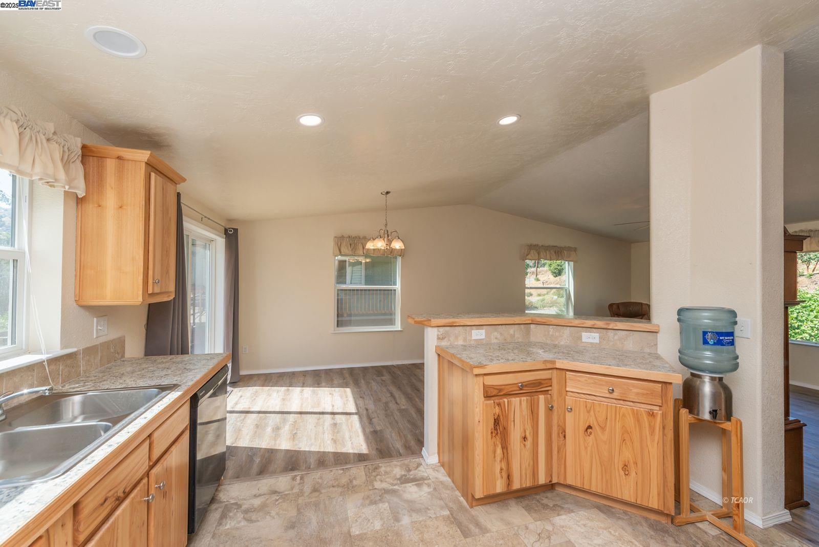 38500 Highway 299 Junction City, CA 96048 - Photo 21 of 49 a spacious bathroom with a granite countertop sink a mirror and a bathtub