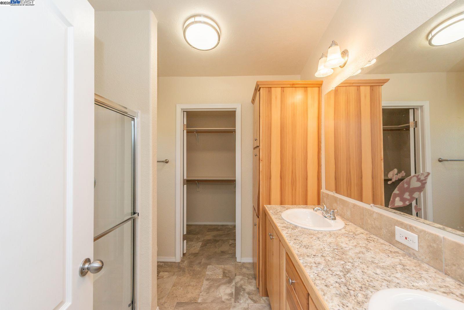 38500 Highway 299 Junction City, CA 96048 - Photo 30 of 49 a bathroom with a granite countertop sink and a mirror