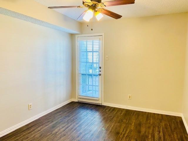 7621 McCallum Boulevard, Unit 108 Dallas, TX 75252 - Photo 13 of 26 an empty room with wooden floor fan and windows