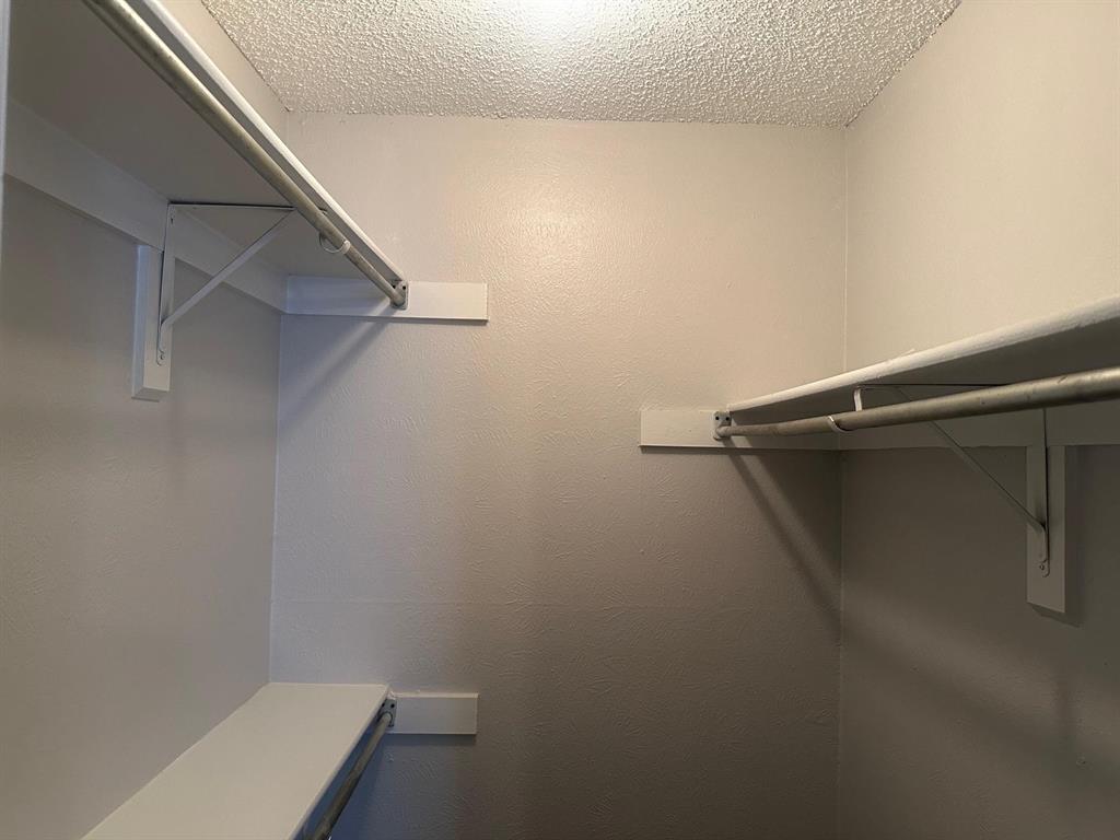 7621 McCallum Boulevard, Unit 108 Dallas, TX 75252 - Photo 14 of 26 a close up of a shower