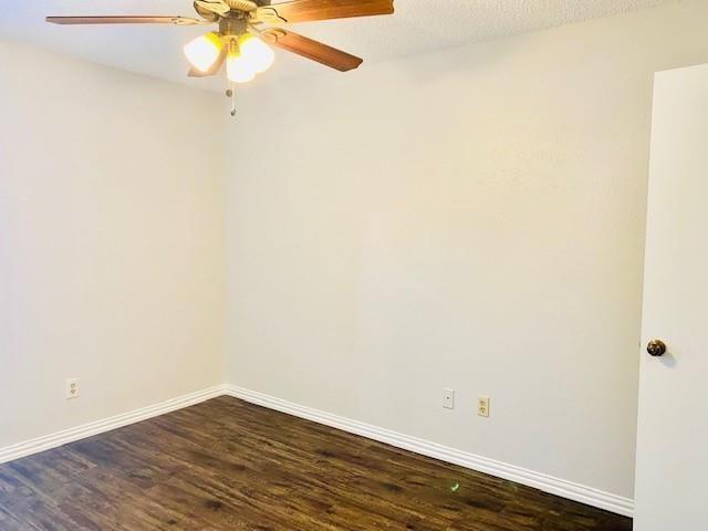 7621 McCallum Boulevard, Unit 108 Dallas, TX 75252 - Photo 16 of 26 an empty room with wooden floor and fan