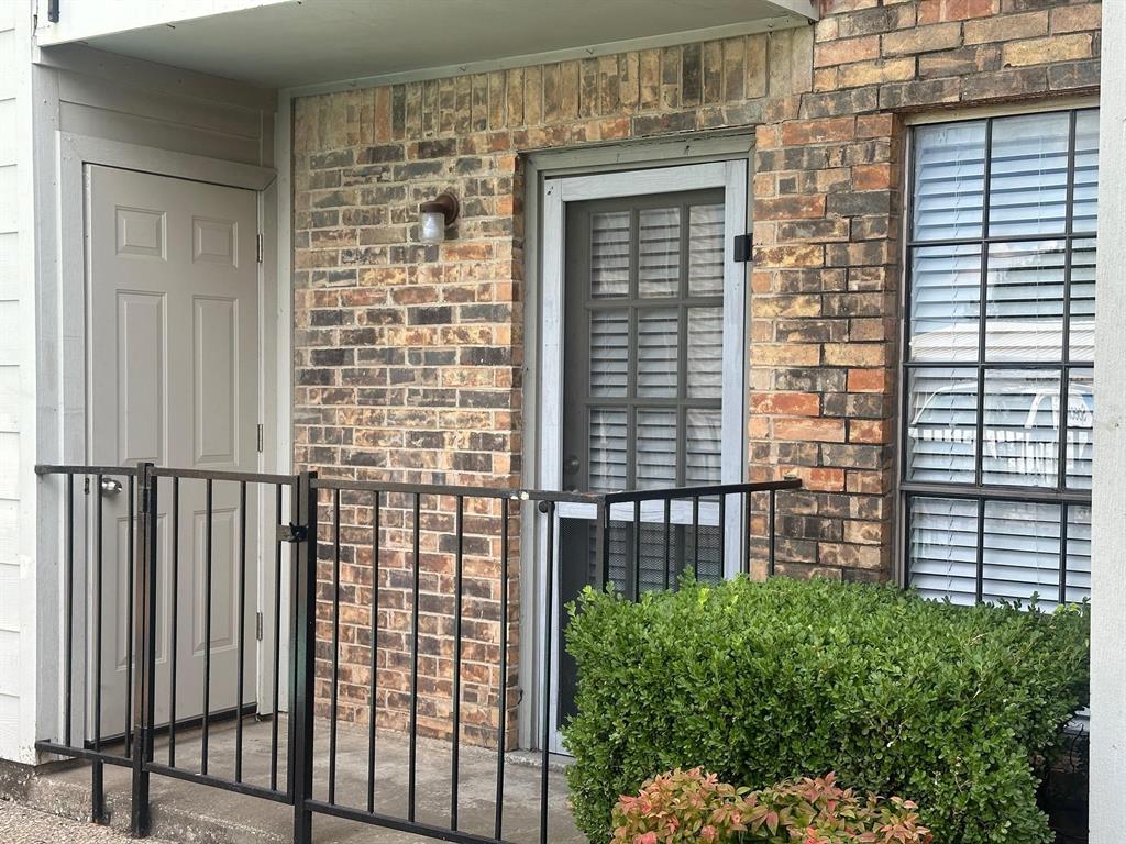 7621 McCallum Boulevard, Unit 108 Dallas, TX 75252 - Photo 24 of 26 a view of a balcony with a floor to ceiling window