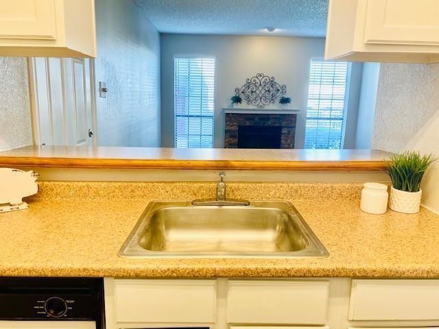 7621 McCallum Boulevard, Unit 108 Dallas, TX 75252 - Photo 3 of 26 a bathroom with a tub sink and mirror